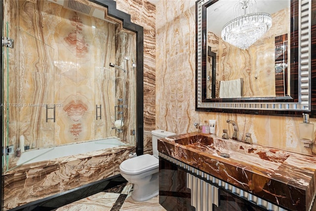 bathroom with toilet, shower / washtub combination, and a notable chandelier