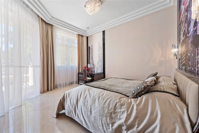 bedroom featuring a notable chandelier and crown molding