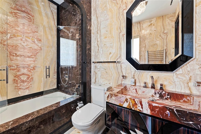 bathroom with decorative backsplash, vanity, and toilet