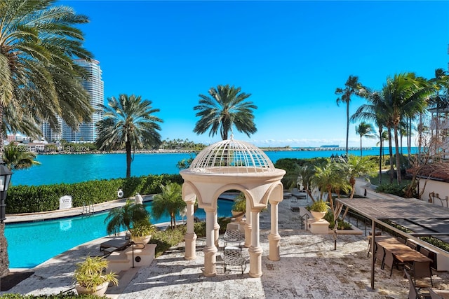 view of pool with a water view