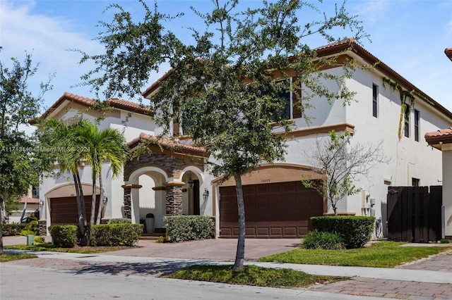 mediterranean / spanish house with a garage