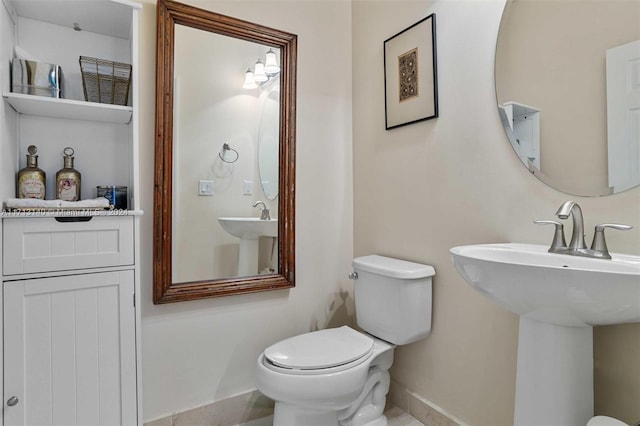 bathroom featuring sink and toilet