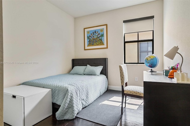 bedroom featuring dark wood-type flooring