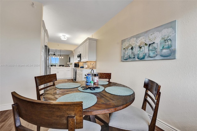 dining area featuring hardwood / wood-style floors