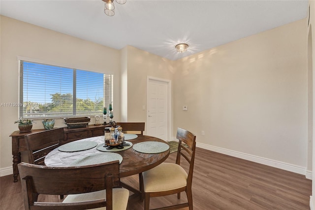 dining space featuring dark hardwood / wood-style floors