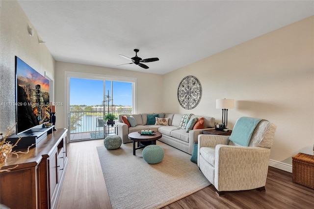 living room with ceiling fan and wood-type flooring