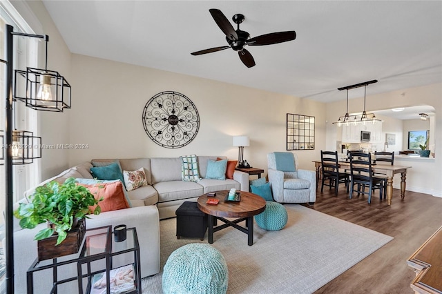 living room with hardwood / wood-style flooring and ceiling fan