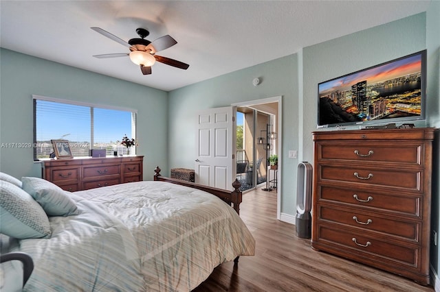 bedroom with ceiling fan and light hardwood / wood-style flooring