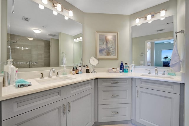 bathroom featuring vanity and a shower with shower door