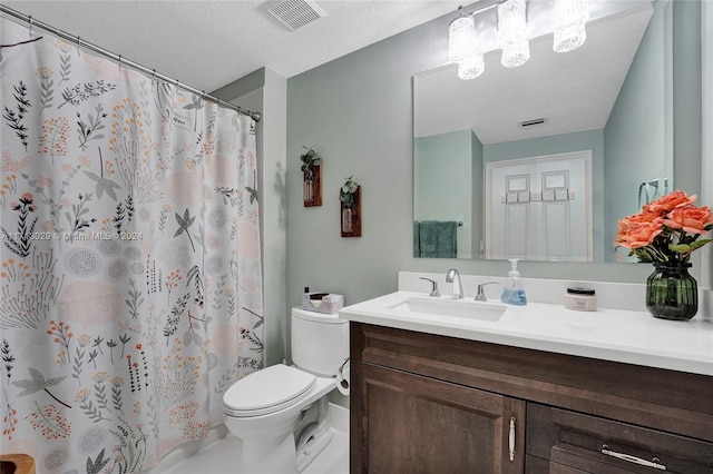 bathroom with a shower with shower curtain, a textured ceiling, vanity, and toilet