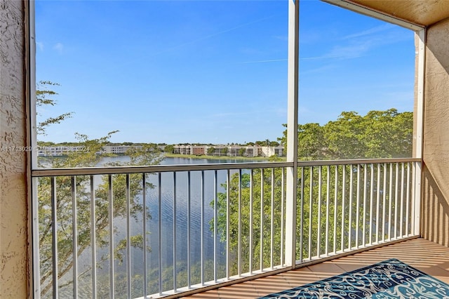 balcony featuring a water view