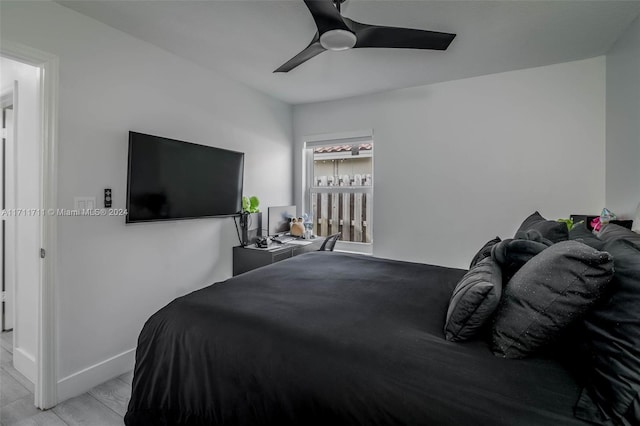 bedroom featuring light hardwood / wood-style floors and ceiling fan