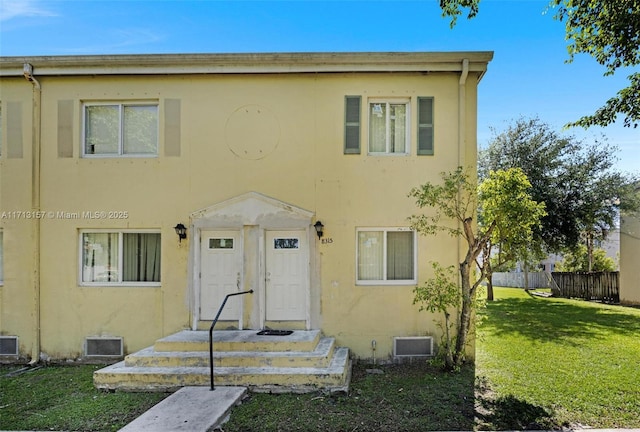 8315 NW 5th Ave Unit 8315, Miami, FL 33150 - townhome / multi-family property with stucco siding, fence, and a front lawn