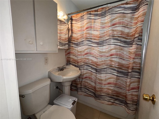 full bathroom with tile patterned flooring, sink, toilet, and shower / tub combo with curtain