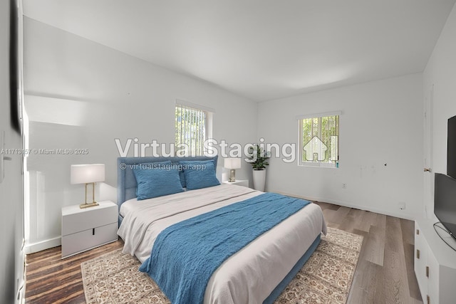 8315 NW 5th Ave Unit 8315, Miami, FL 33150 - bedroom featuring baseboards and wood finished floors