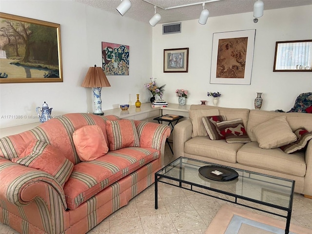 living room with a textured ceiling