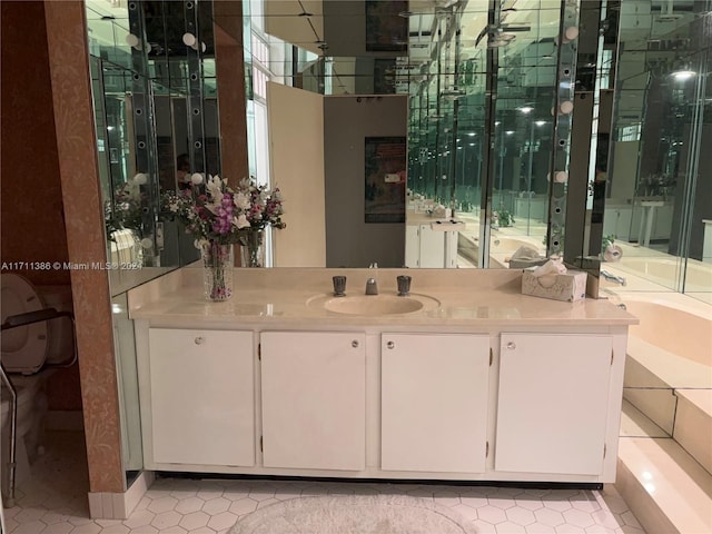 bathroom featuring tile patterned floors, plenty of natural light, and vanity