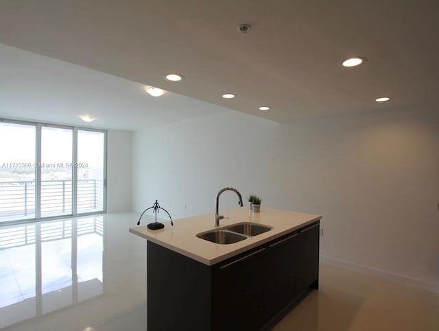 7875 NW 107th Ave Unit 719, Doral, FL 33178 - kitchen with recessed lighting, light countertops, and a kitchen island with sink