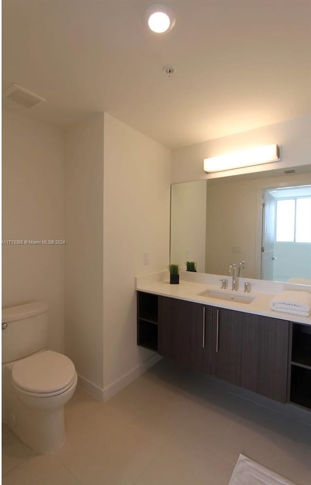 7875 NW 107th Ave Unit 719, Doral, FL 33178 - bathroom featuring tile patterned floors and vanity