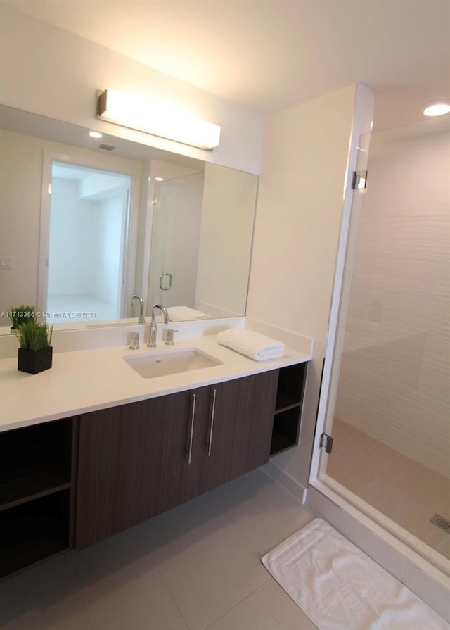 7875 NW 107th Ave Unit 719, Doral, FL 33178 - full bathroom with a stall shower, tile patterned flooring, and vanity