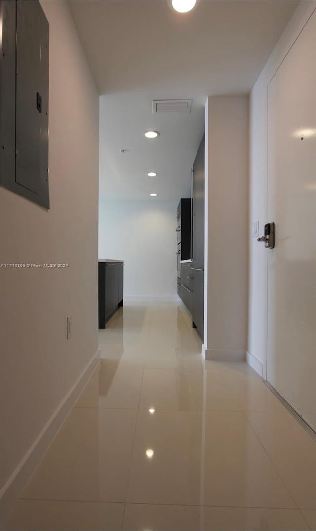 7875 NW 107th Ave Unit 719, Doral, FL 33178 - hallway with electric panel, light tile patterned floors, and recessed lighting