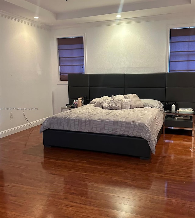 bedroom featuring dark hardwood / wood-style flooring