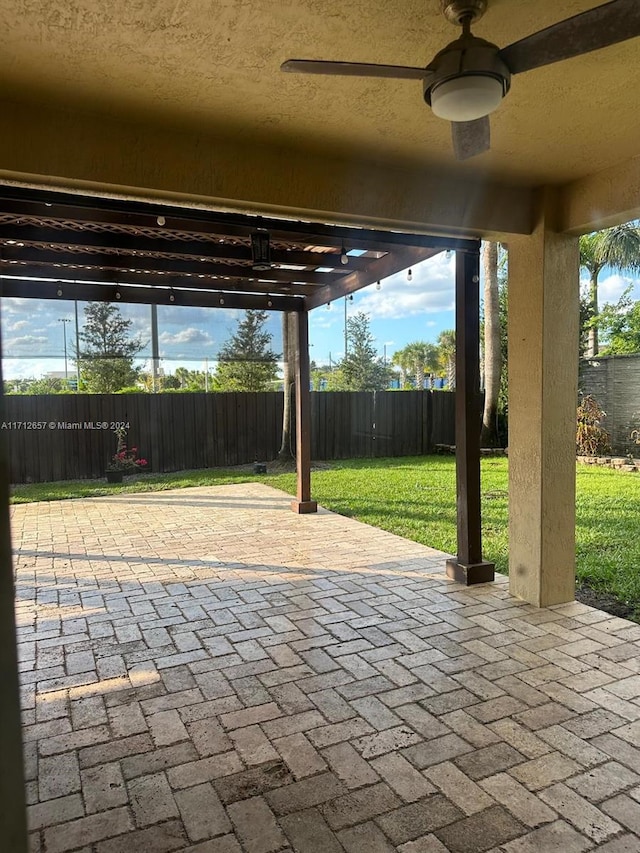 view of patio featuring ceiling fan