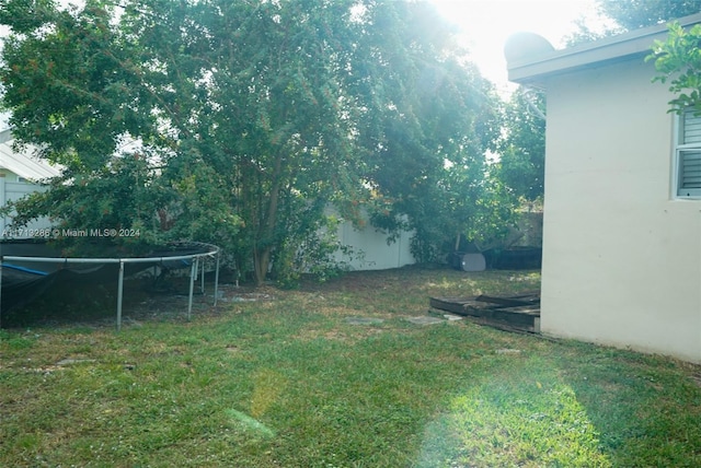 view of yard with a trampoline