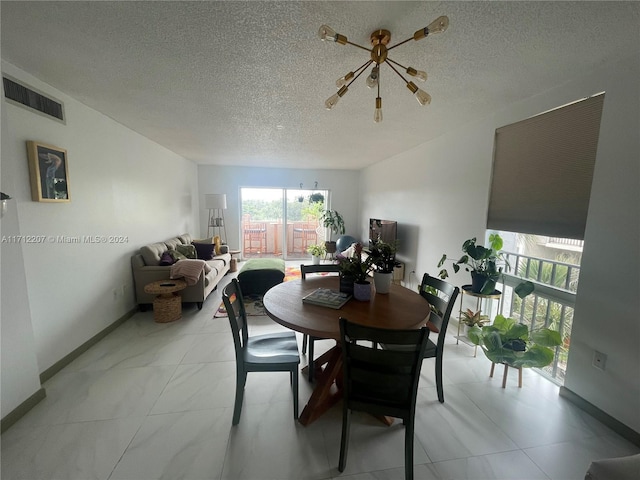 dining space with a textured ceiling