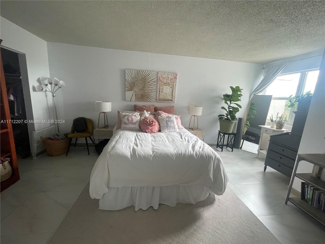 bedroom featuring a textured ceiling