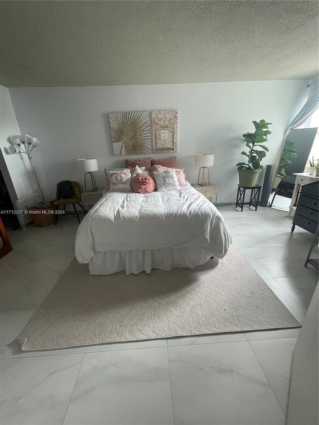 bedroom with a textured ceiling