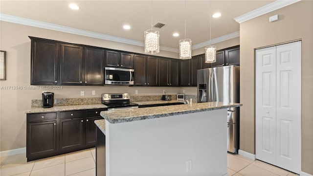 kitchen with stainless steel appliances, light stone counters, pendant lighting, a kitchen island with sink, and ornamental molding