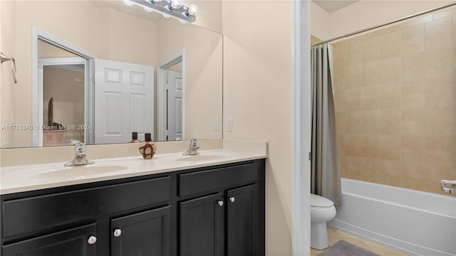 full bathroom featuring tile patterned flooring, shower / bath combo, vanity, and toilet