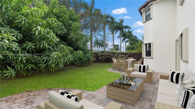 view of yard featuring an outdoor living space and a patio