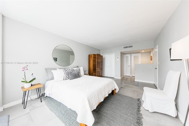 bedroom featuring concrete floors