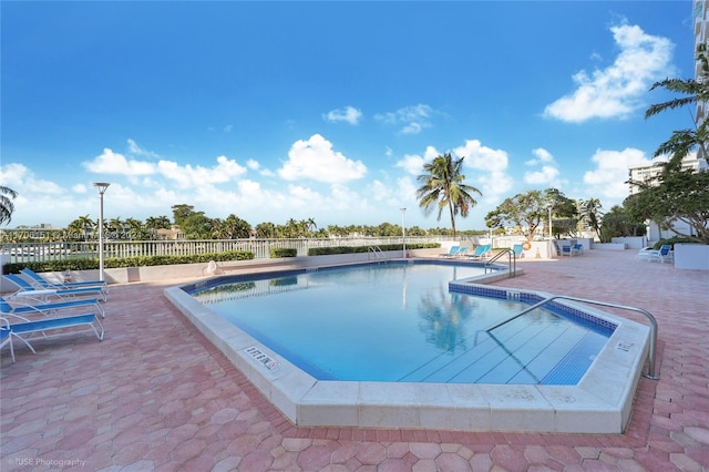 view of swimming pool with a patio area