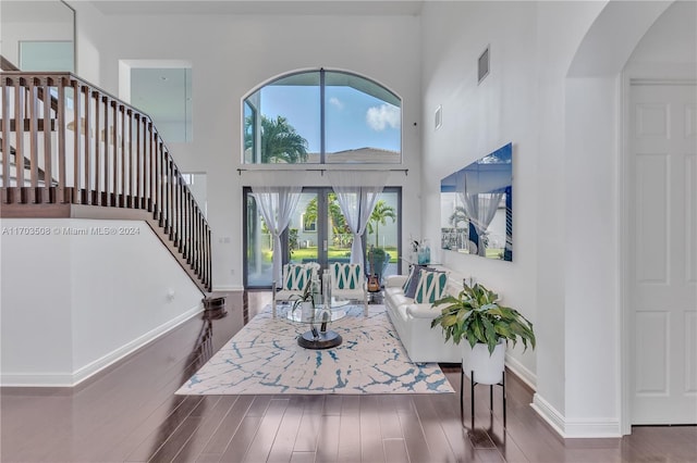 foyer featuring french doors, a high ceiling, and dark hardwood / wood-style floors