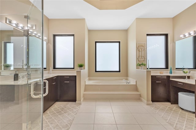 bathroom with separate shower and tub, tile patterned flooring, and vanity