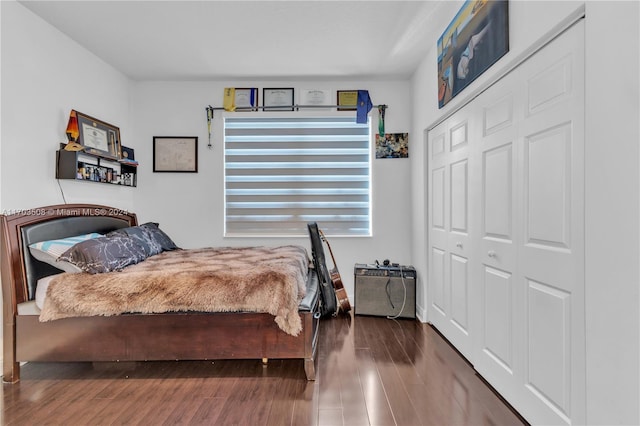 bedroom with hardwood / wood-style flooring and a closet