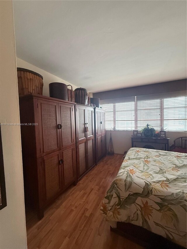 bedroom with wood-type flooring