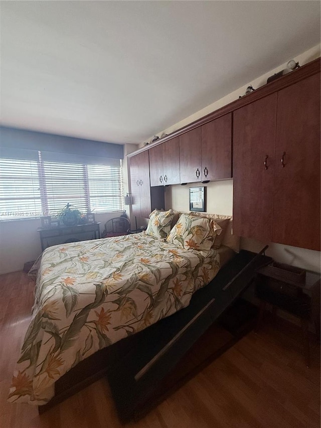 bedroom featuring wood finished floors