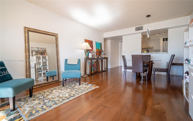 dining area featuring dark wood-type flooring