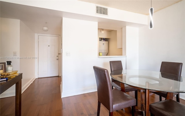 dining space with dark hardwood / wood-style floors