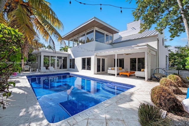 view of swimming pool with a patio area, ceiling fan, and an outdoor living space