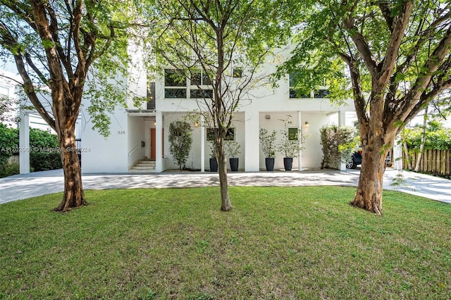 contemporary house with a front yard