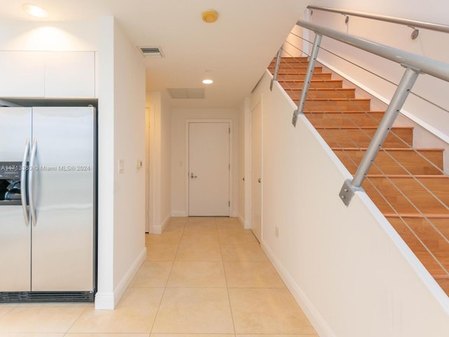 hallway with light tile patterned flooring