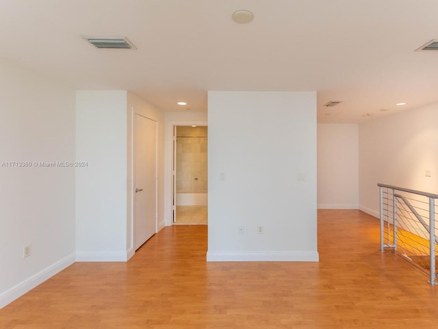 spare room featuring light wood-type flooring