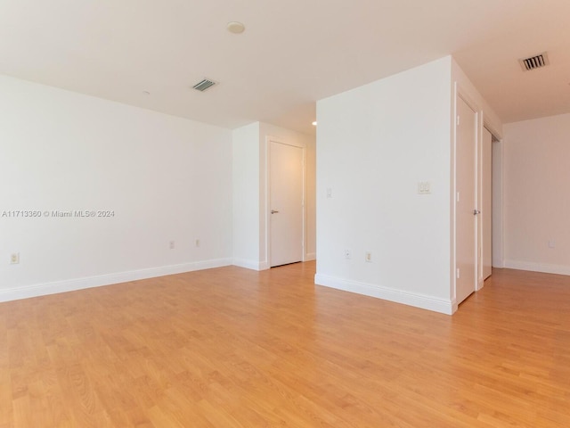 unfurnished room featuring light hardwood / wood-style flooring