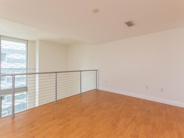 spare room featuring hardwood / wood-style floors