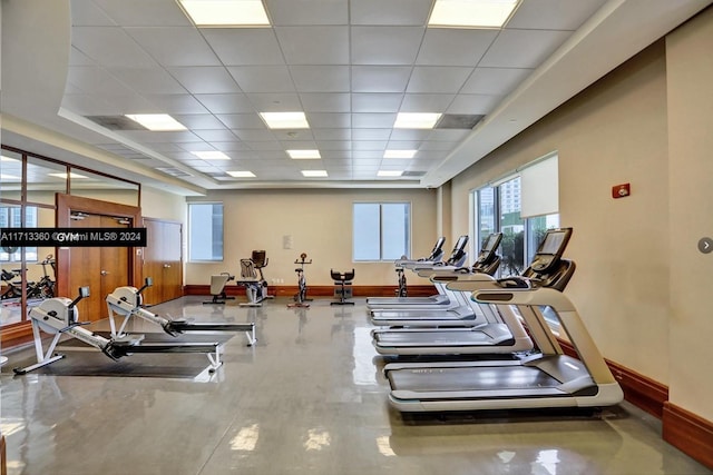 exercise room with a drop ceiling